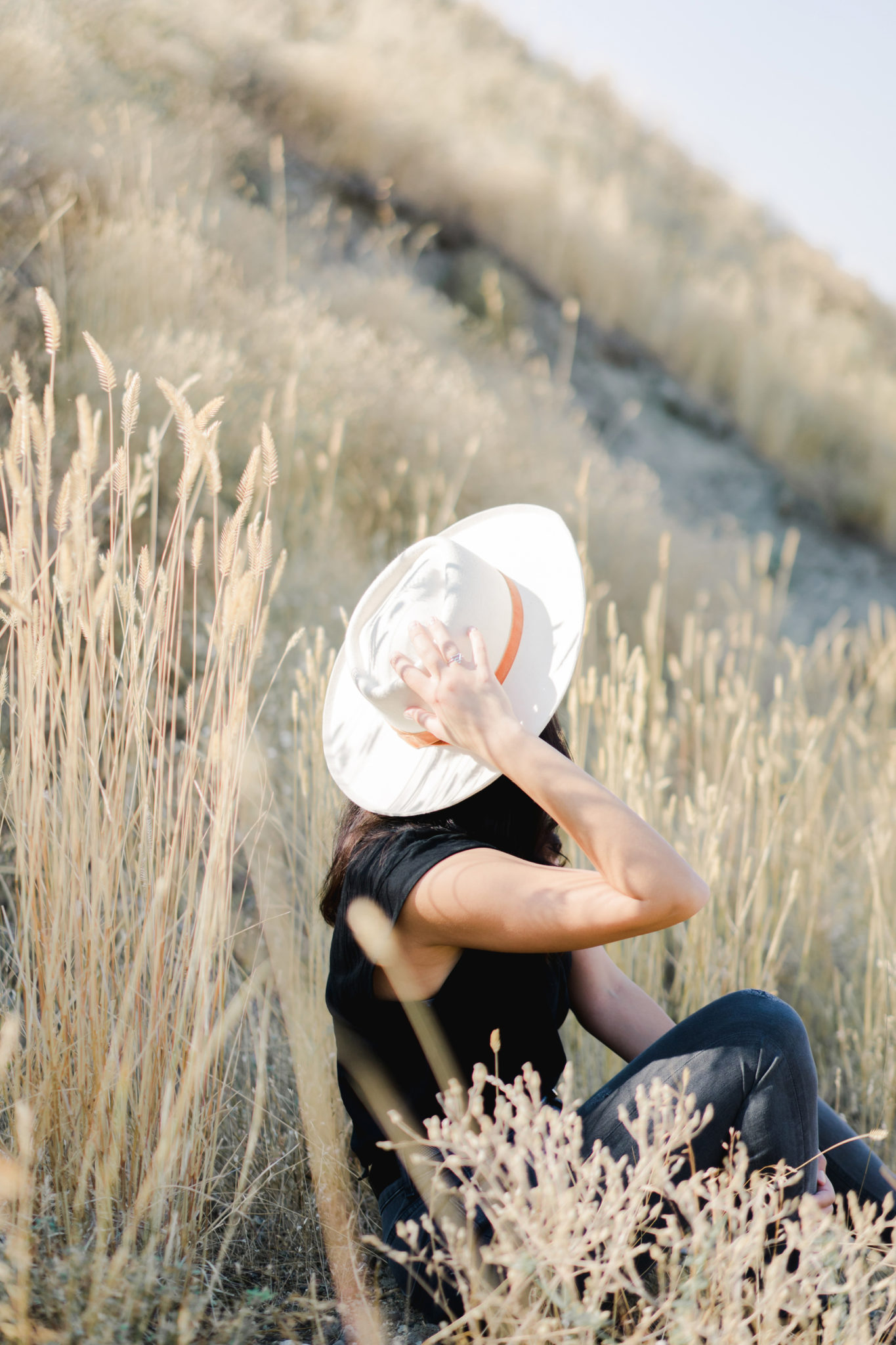 Woman relaxing in wheat field